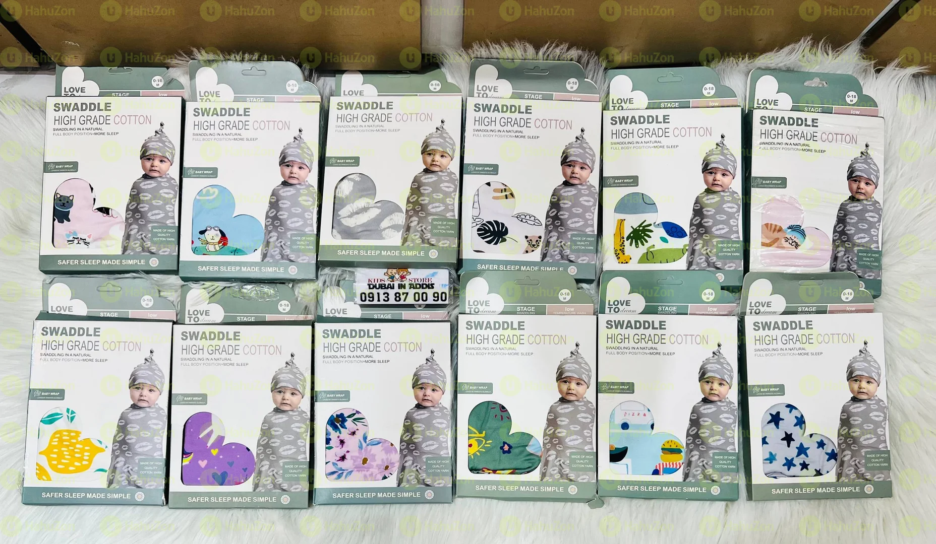 የአራስ ልጆች መጠቅለያ ከኮፍያ ጋር